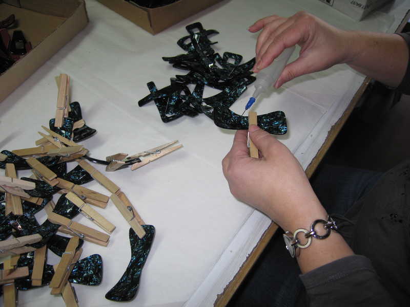 Hand assembly of cellulose acetate accessories using adhesive and clamps